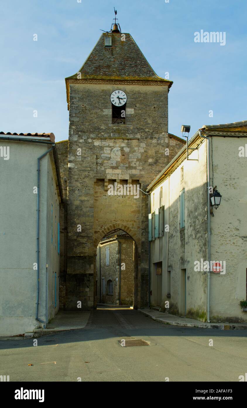 The clock tower and entarnce into the bastide of Duras Stock Photo