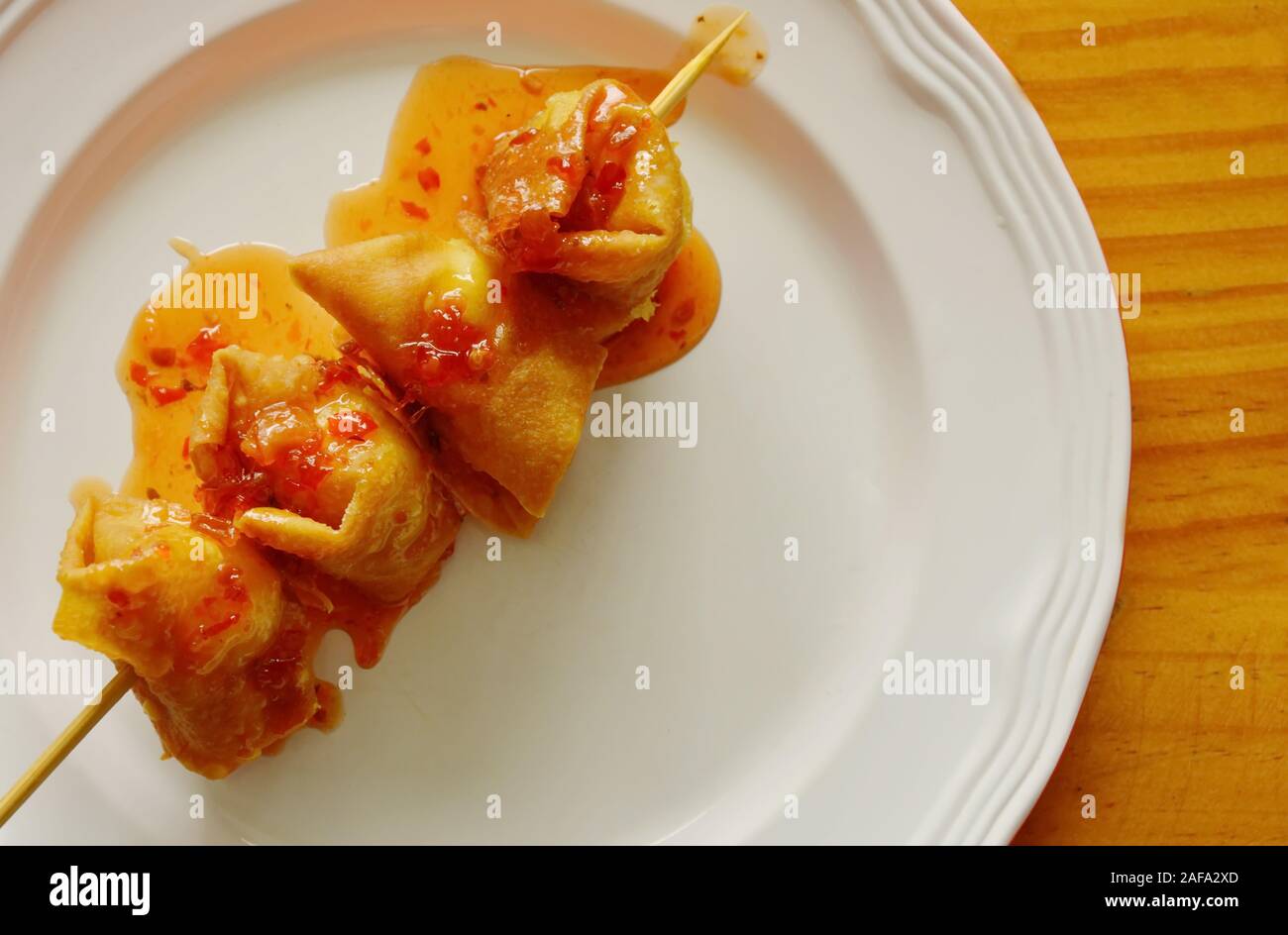 deep fried dumpling paste wrapped quail egg stab in wooden stick