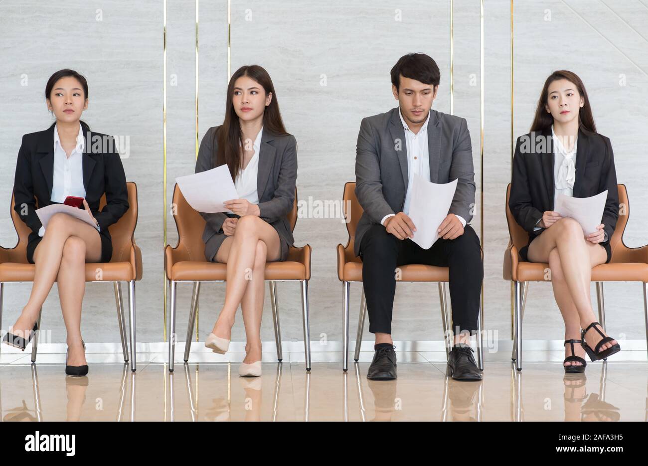 Asian business people are stressed about waiting for a job interview. Stock Photo