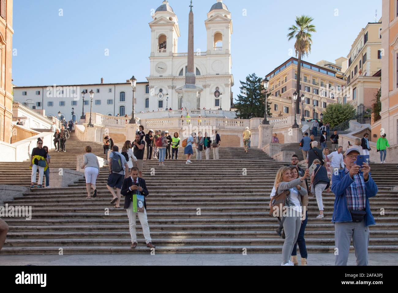 Security guards on the Spanish Steps in Rome stop tourists sitting down to avoid congestion around a popular attraction Stock Photo