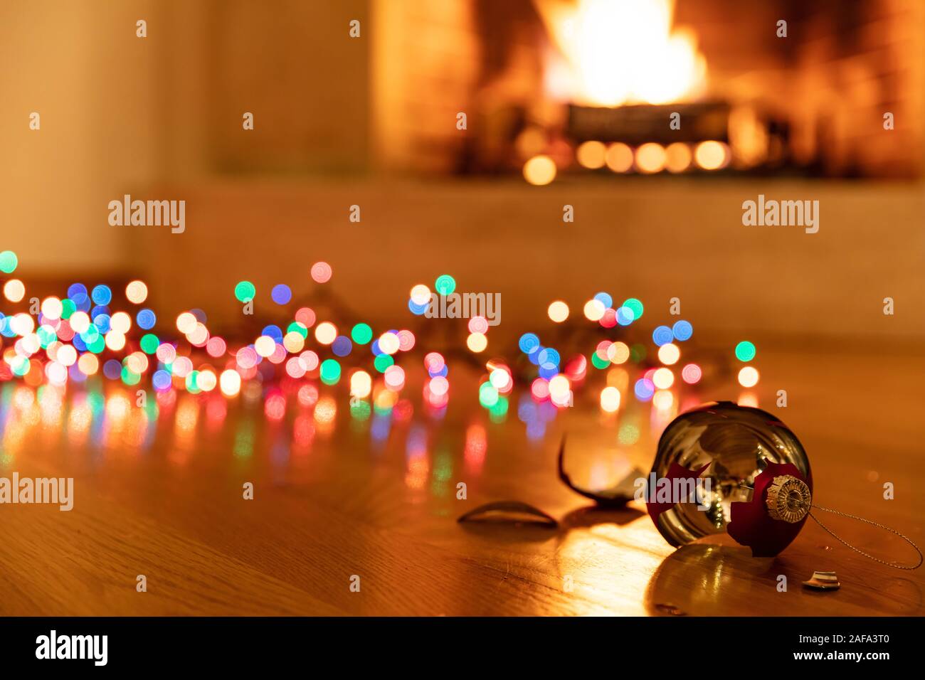 Christmas ball broken. Xmas holiday decoration, lights glowing, blur