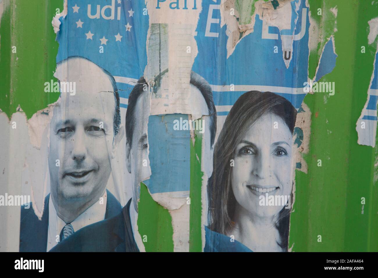Torn political posters on a wall in Paris Stock Photo