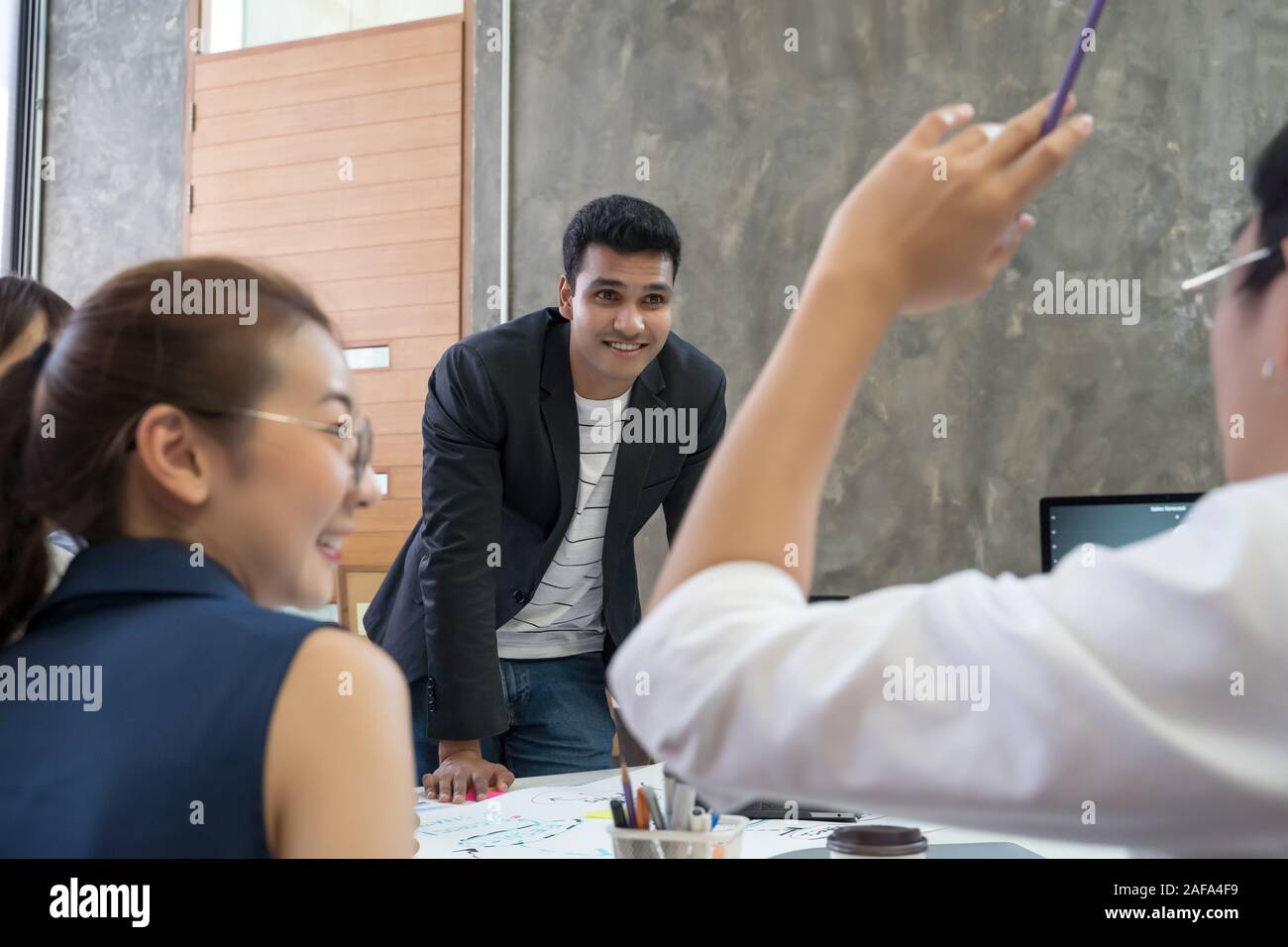 Group of Asian business people team meeting in modern office working ...