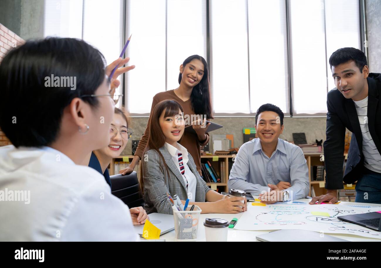 Group of Asian business people team meeting in modern office working ...