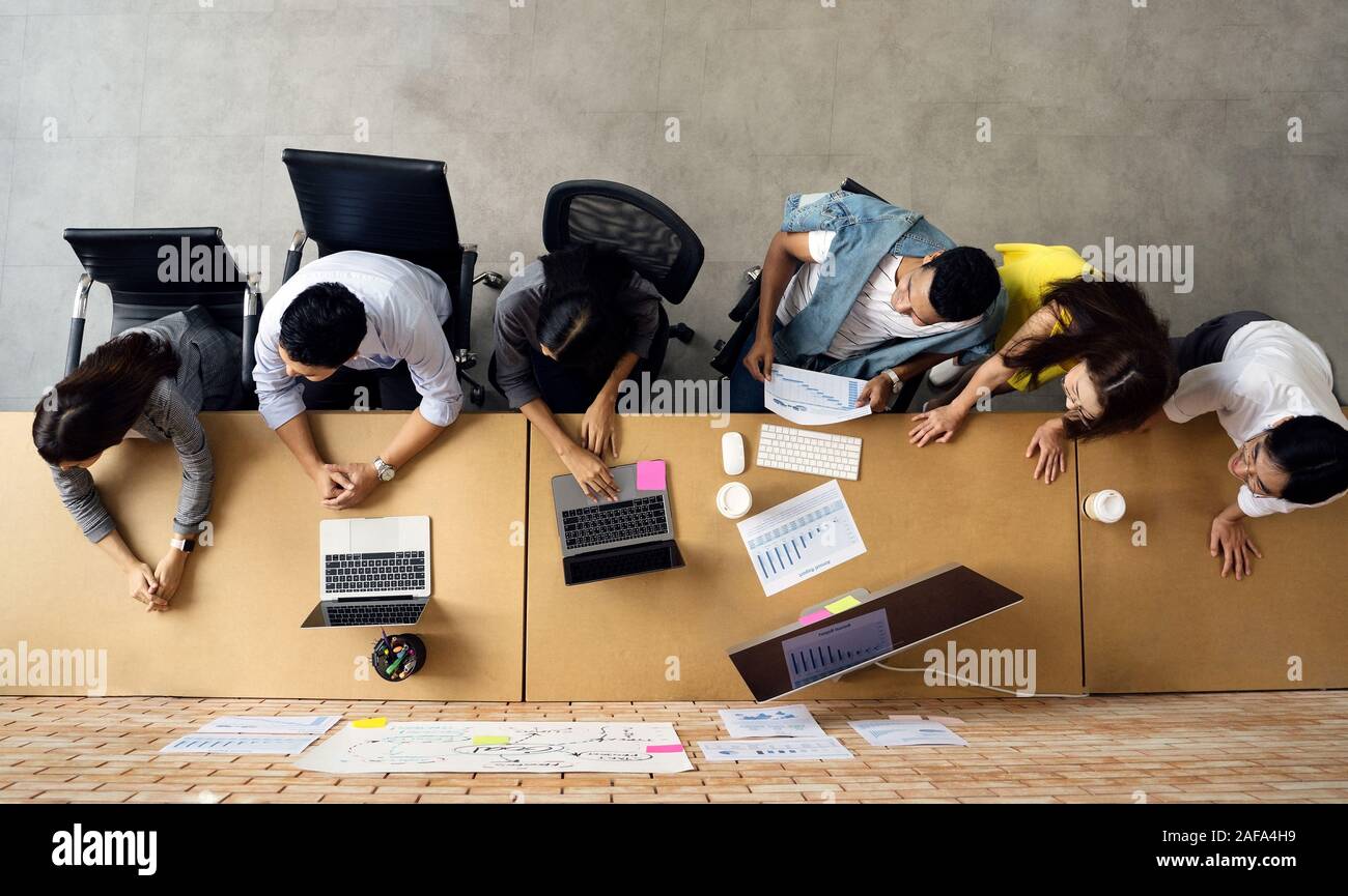 Group of Asian business people team meeting in modern office working ...