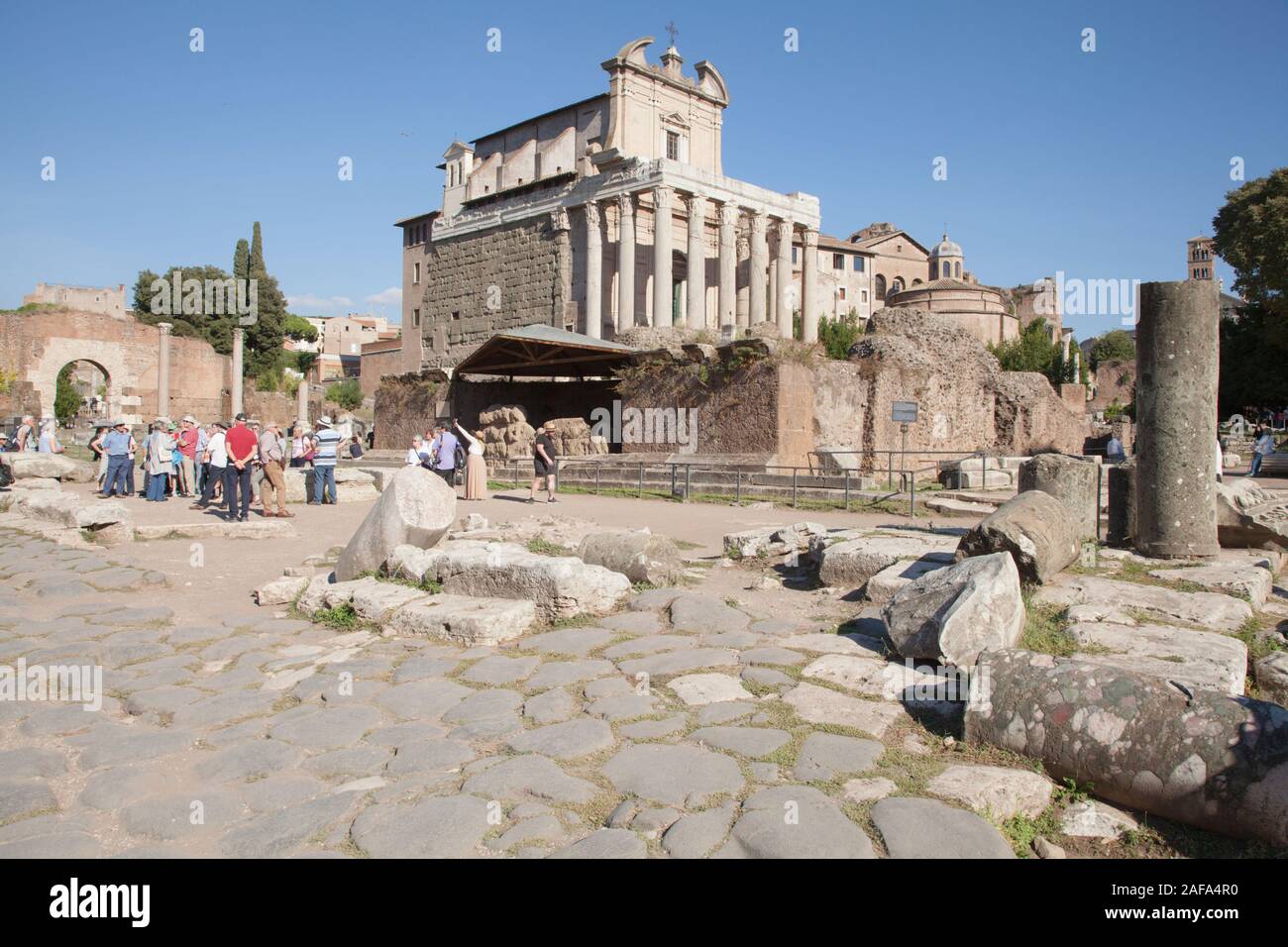 The Roman Forum is a forum (plaza) surrounded by the ruins of several government buildings and a tourist hotspot Stock Photo