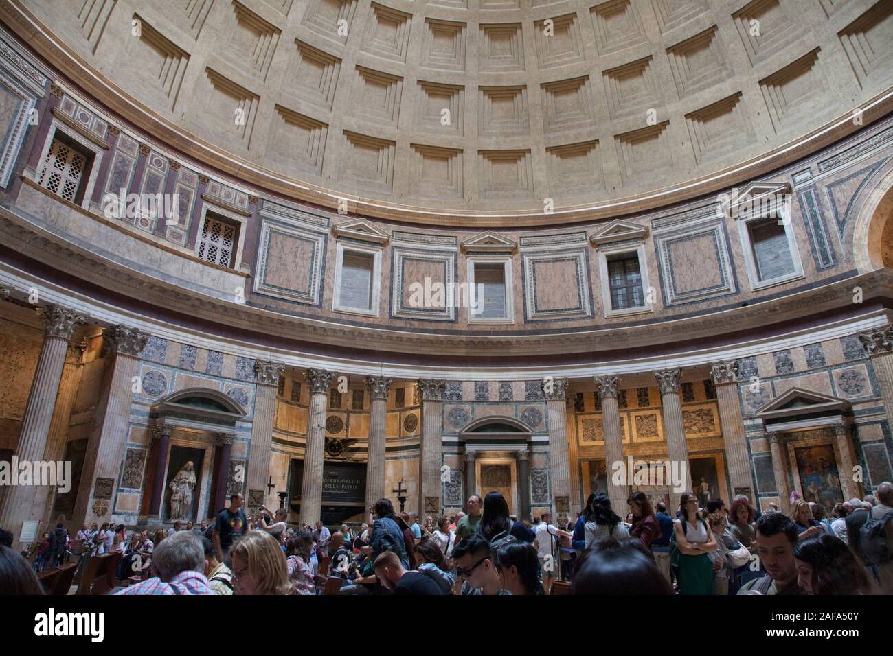 Visitors inside the Pantheon in Rome, a former Roman temple and now a church Stock Photo