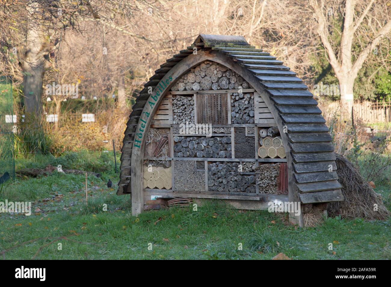 A man made habitat for insects and wildlife, often called a bug hotel, in Le Jardin des Plantes, Paris Stock Photo