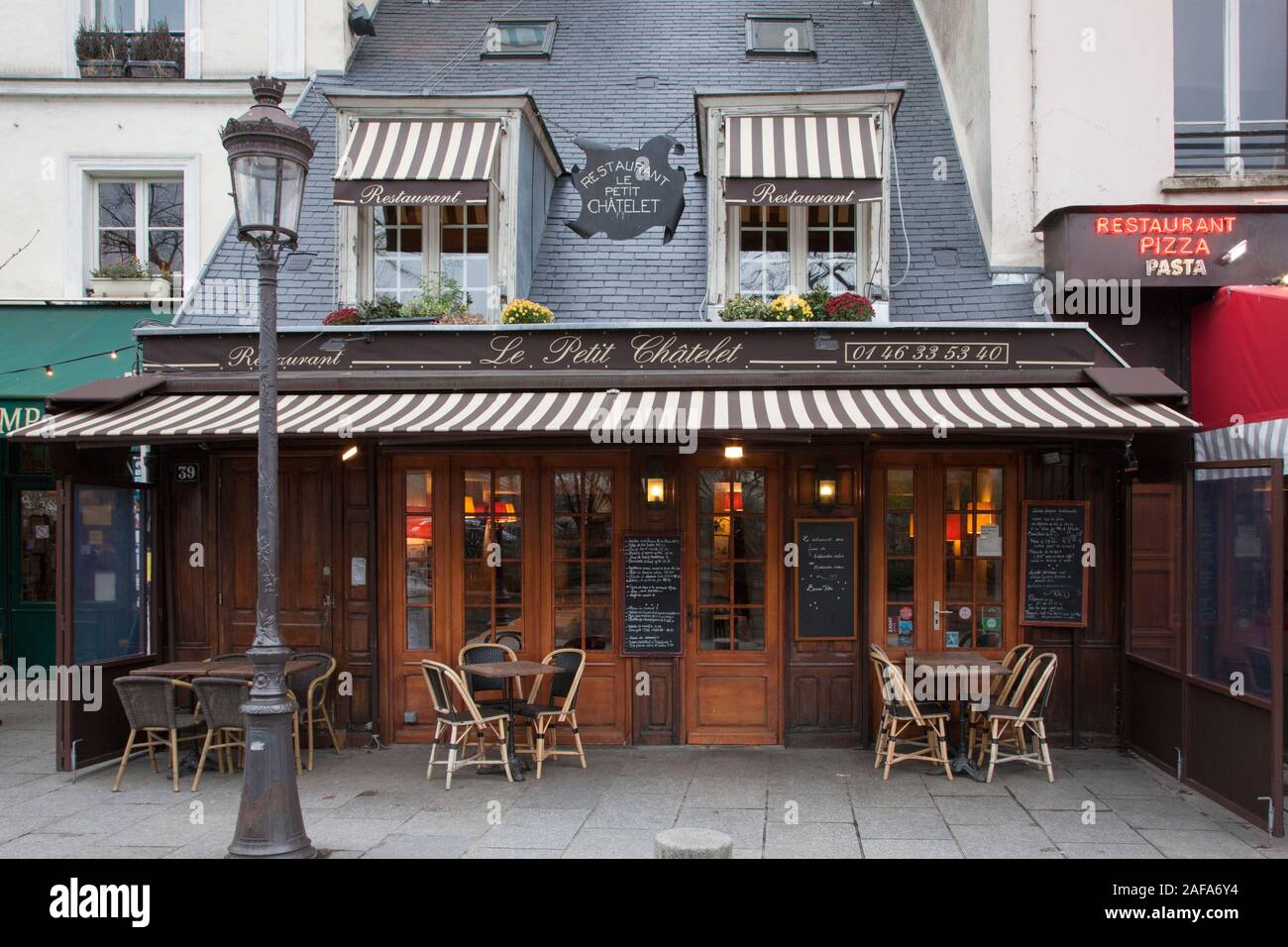 Le Petit Chatelet restaurant is in Saint Michel and overlooks the River Seine and Notre Dame in Paris Stock Photo
