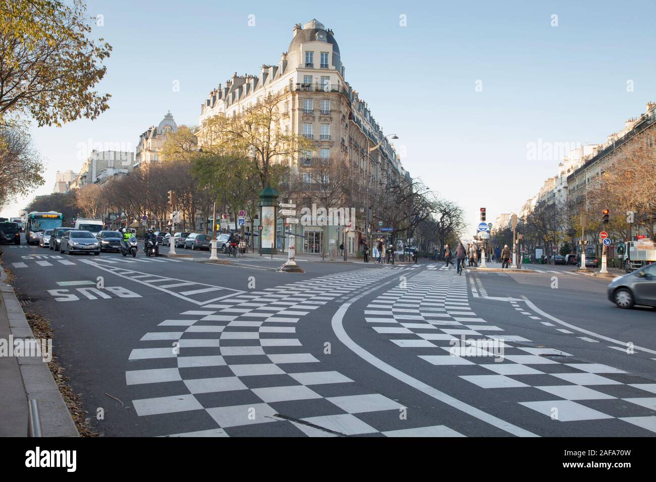 Chequered road markings mark the area of a public transport lane (bus or tram) that should not be blocked by other traffic Stock Photo