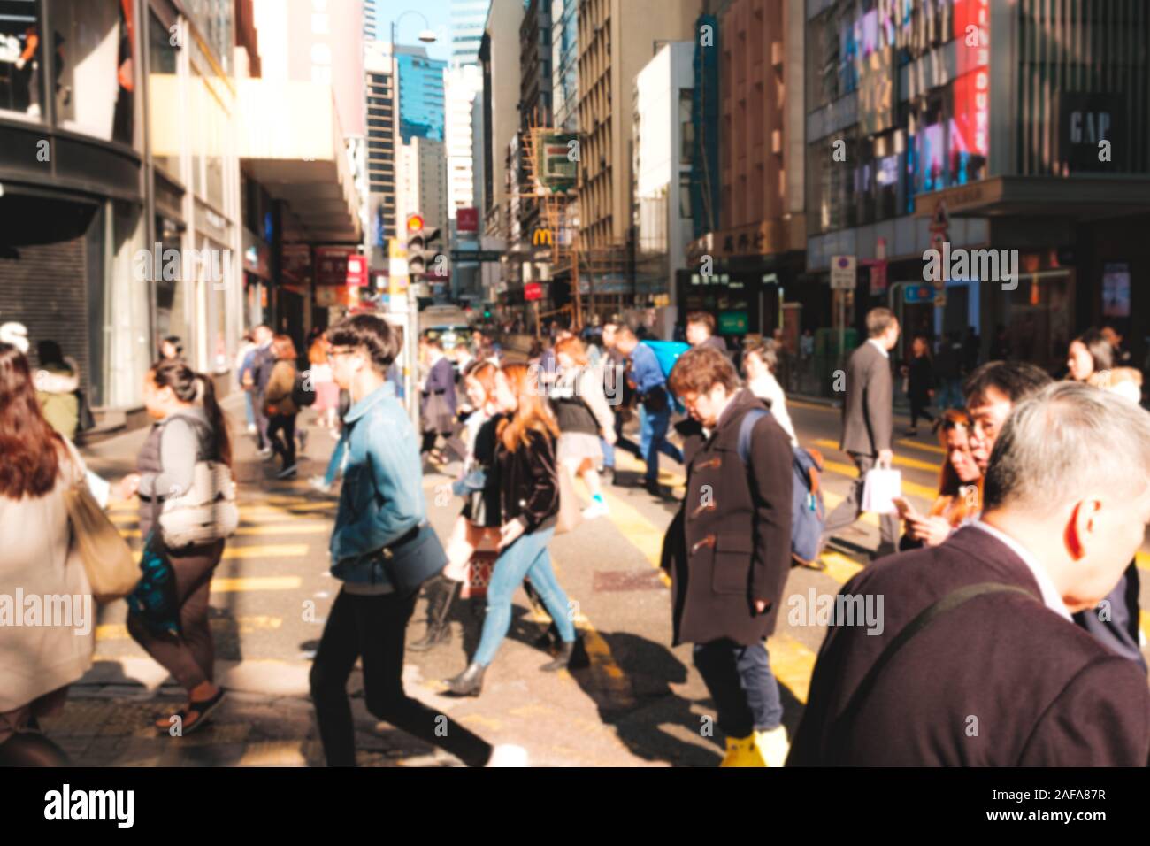 HongKong, China - November, 2019: Blurry image of unrecognizable people crossing street in Hong Kong Stock Photo