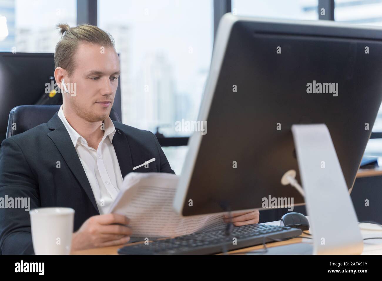 businessman read newspaper in office Stock Photo