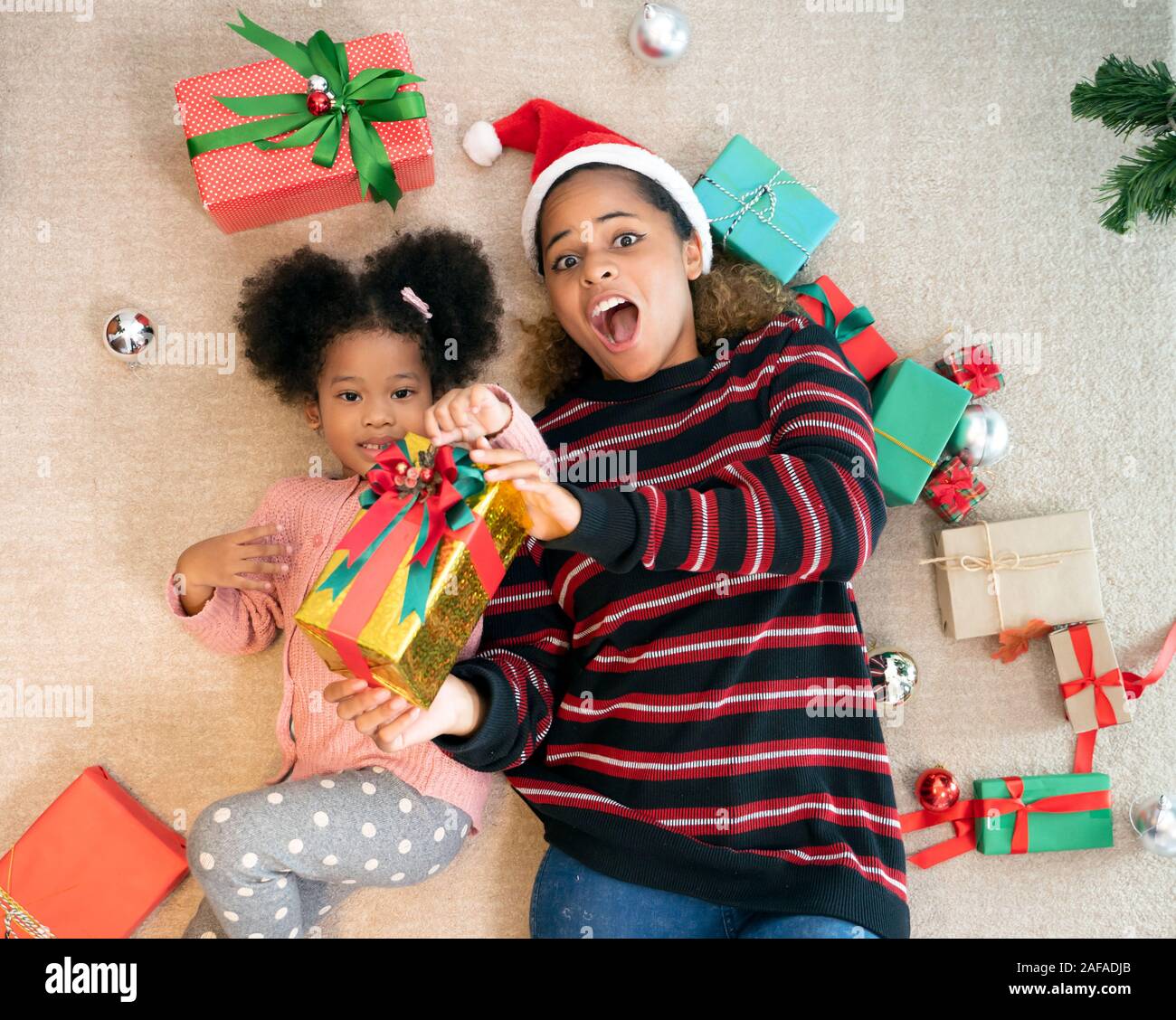 Portrait of Family exchange gifts on Christmas. Stock Photo