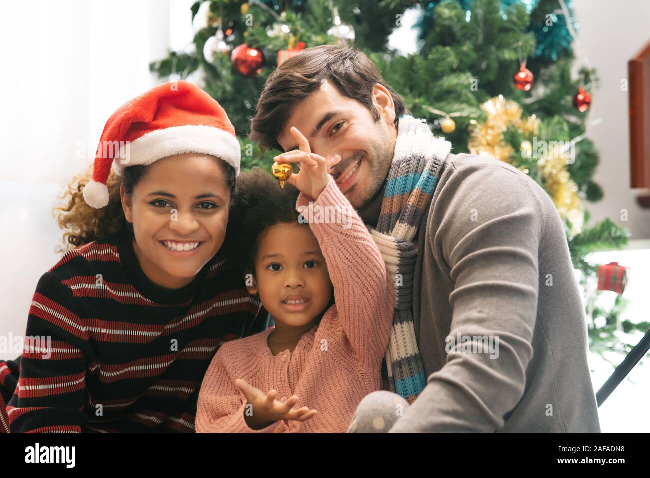 Portrait happy family decorated for Christmas Stock Photo