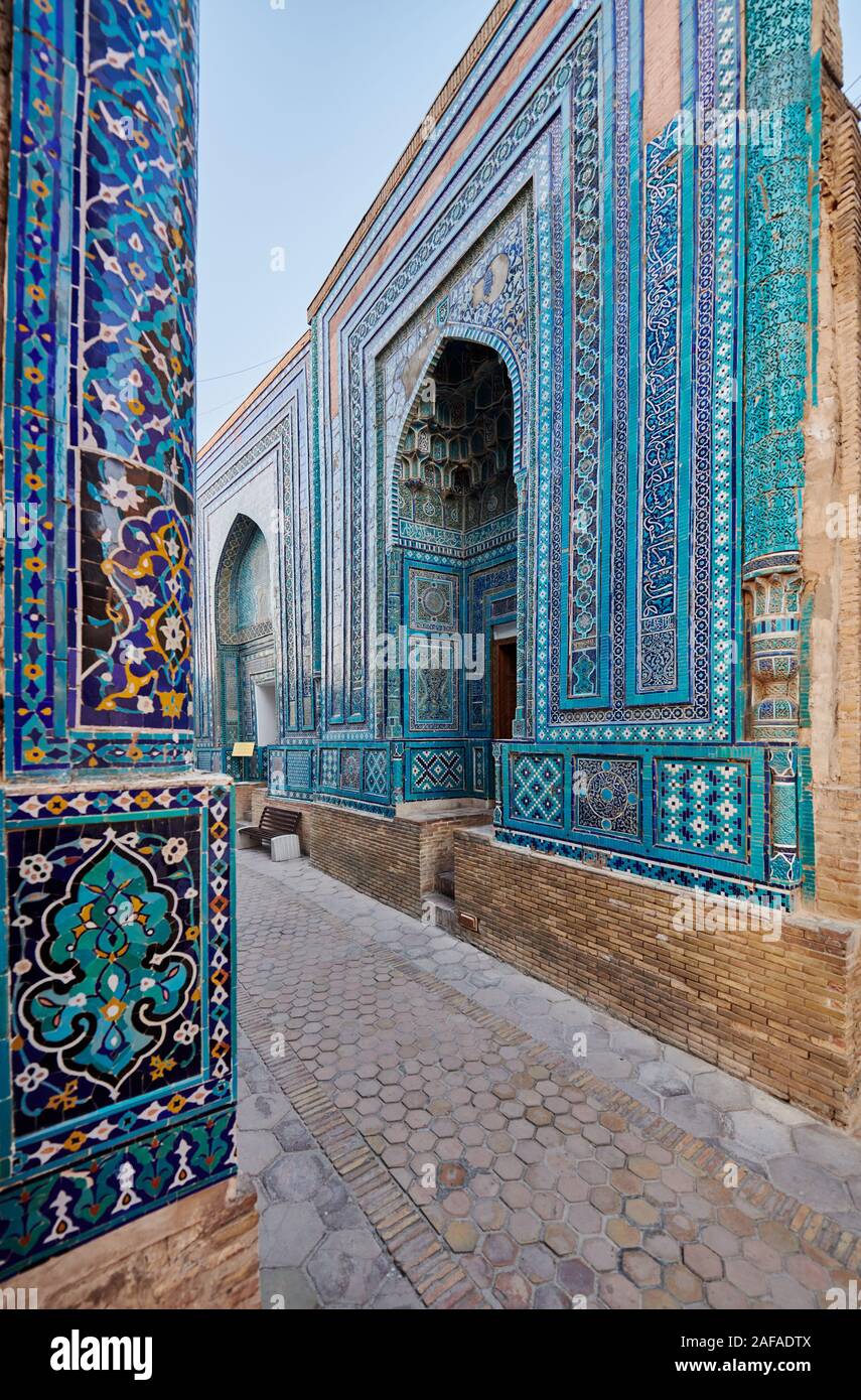 narrow path through facades heavily decorated with blue tiles in necropolis Shah-i-Zinda, Samarqand, Uzbekistan, Central Asia Stock Photo