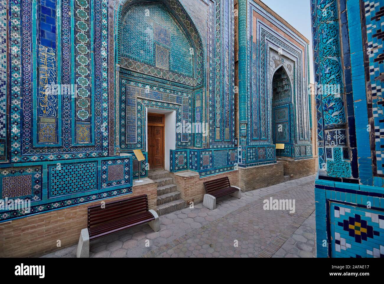 narrow path through facades heavily decorated with blue tiles in necropolis Shah-i-Zinda, Samarqand, Uzbekistan, Central Asia Stock Photo