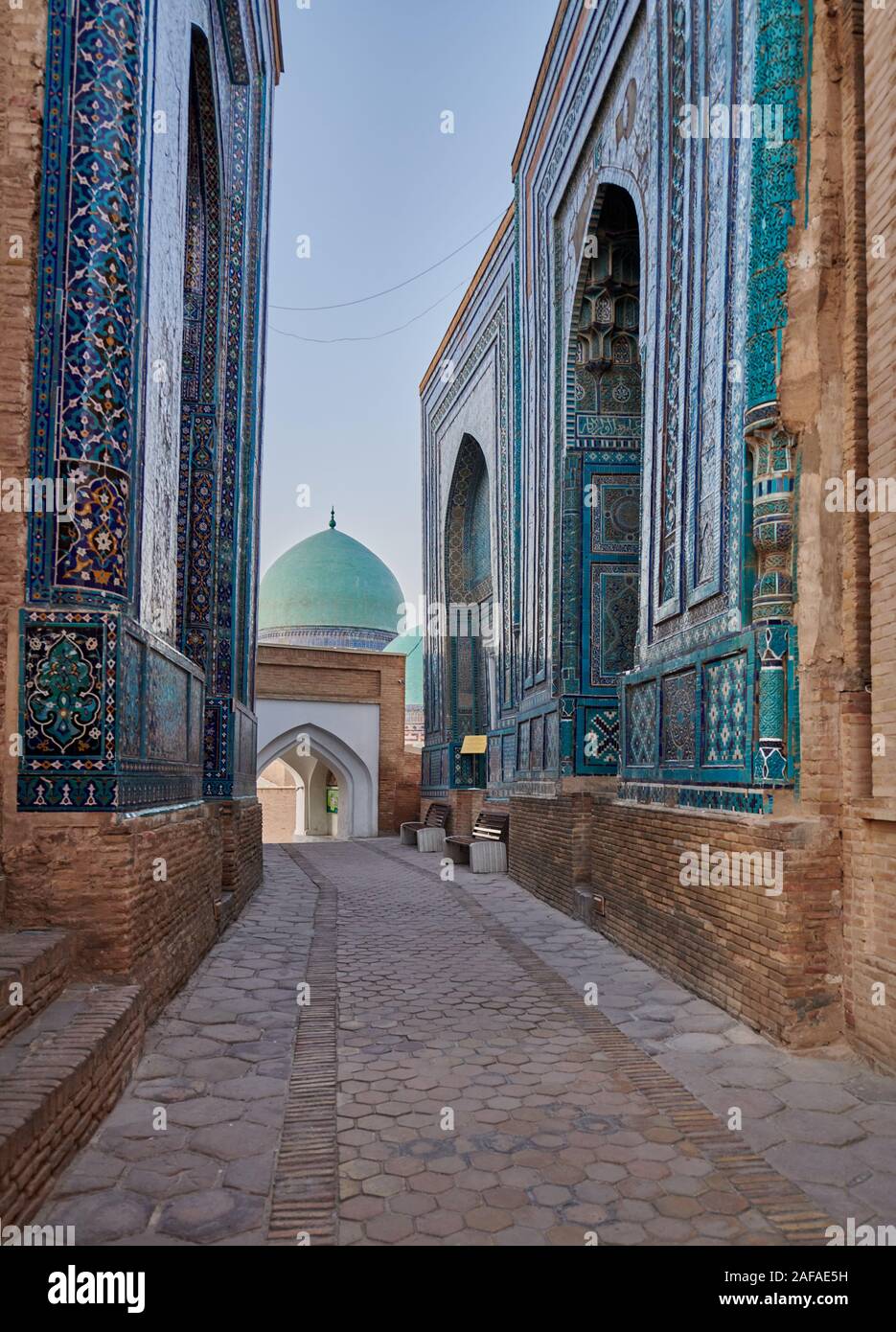 narrow path through facades heavily decorated with blue tiles in necropolis Shah-i-Zinda, Samarqand, Uzbekistan, Central Asia Stock Photo