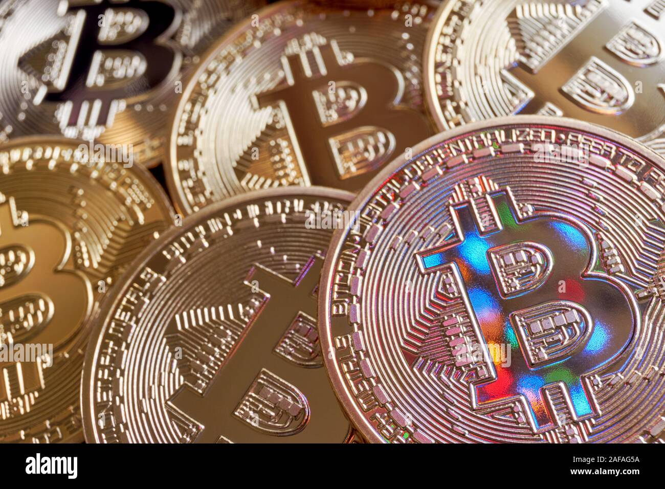 Blue and Pink Bitcoin Crypto Currency on a Black Stock Photo - Alamy
