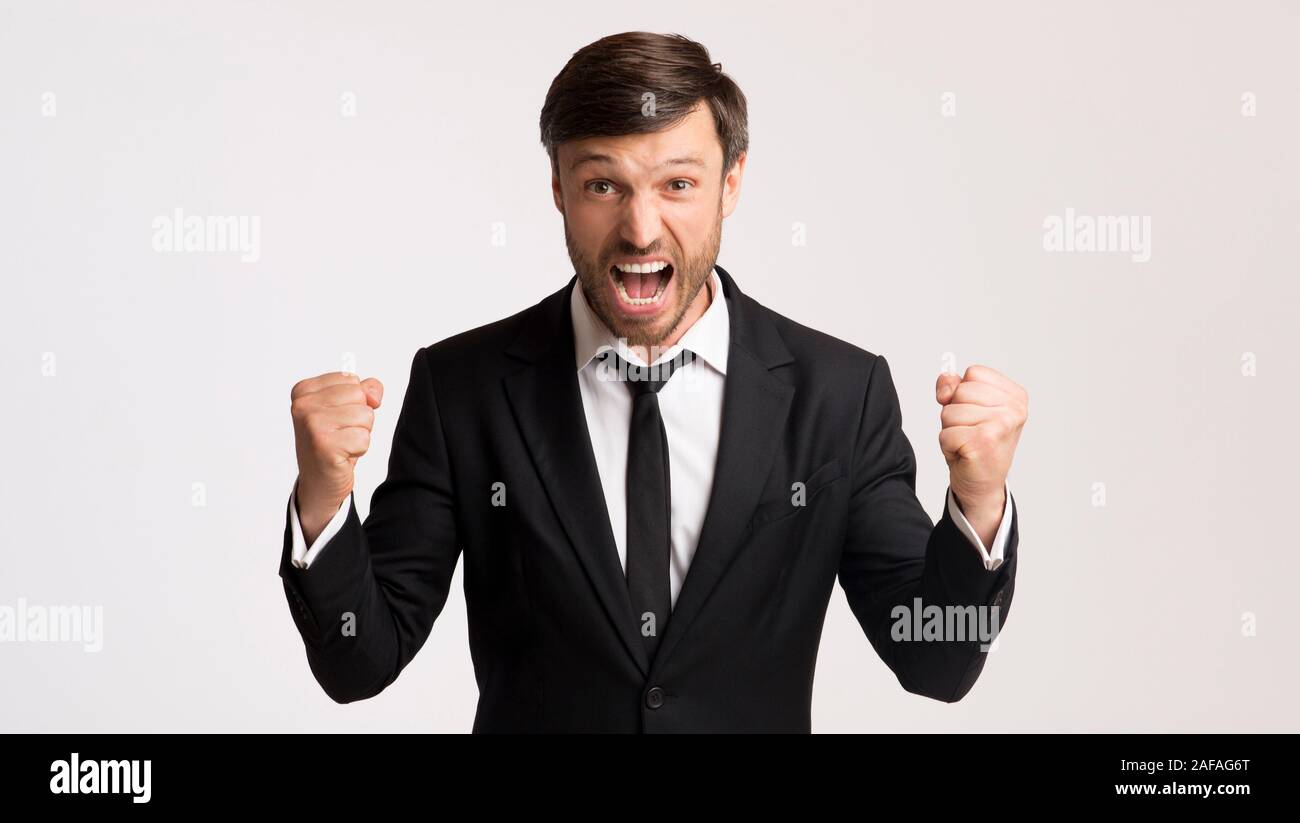 Businessman Shouting Shaking Fists Celebrating Business Success In ...