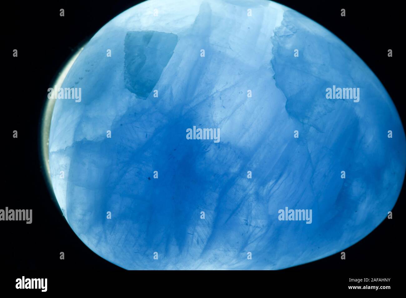 Blue Calcite Crystal. CaCO3, Backlit. Macro Geology Photo. UK. Stock Photo