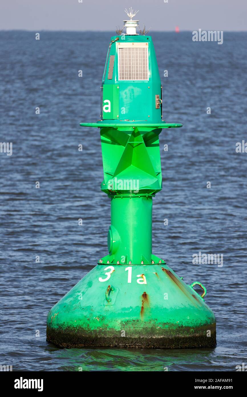 green lateral buoy at the edge of a fairway Stock Photo Alamy