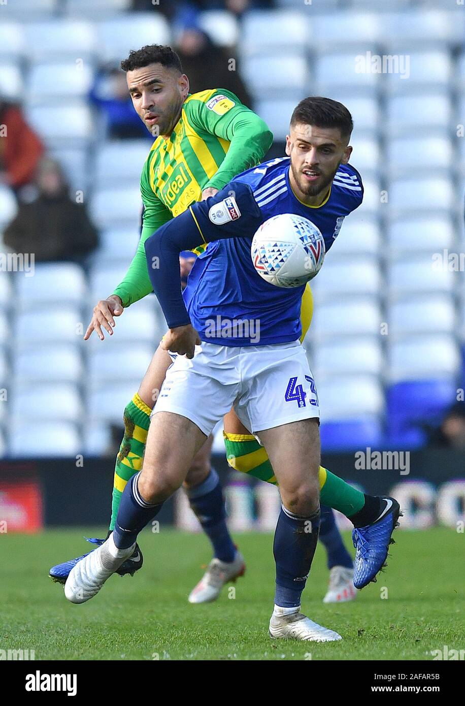 West Bromwich Albion's Hal RobsonKanu (left) and Birmingham City's Geraldo Bajrami battle for