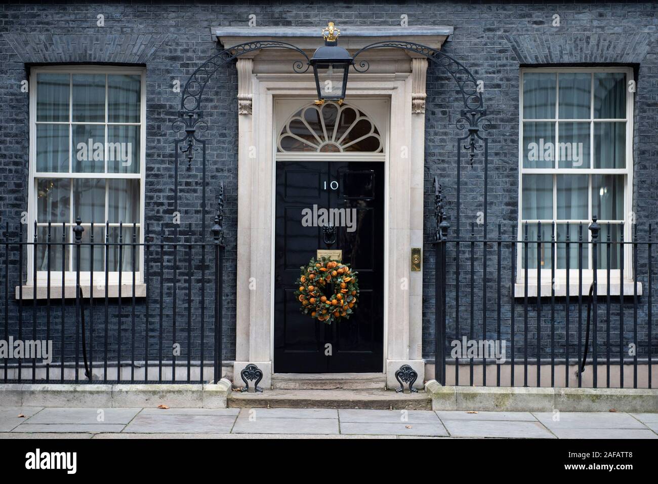 A Christmas wreath is displayed on the door of 10 Downing Street in London. Stock Photo