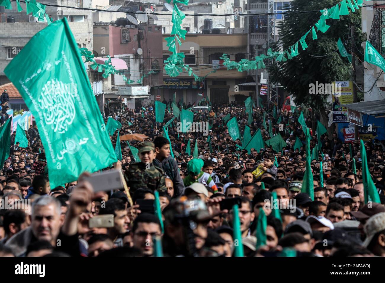 December 13, 2019: Gaza, Palestine. 13 December 2019. The Palestinian Islamic resistance movement of Hamas hold a rally to celebrate the 32th anniversary of its foundation, in the Jabalia refugee camp in the northern Gaza Strip. Hamas political bureau member, Fathi Hamad, delivered a speech at the event, which was titled ''With the edge of the sword we eliminated falsehood''. Hamas was founded in December 1987, by its late leader Sheikh Ahmed Yassin. Hamas won the 2006 Palestinian legislative elections and assumed administrative control of Gaza in June 2007 (Credit Image: © Ahmad Hasaballah/IM Stock Photo