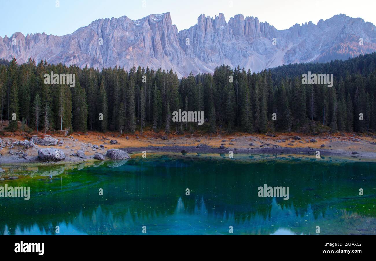 Beautiful Carezza Lake (Lago di Carezza) in background Latemar Mountains in Dolomites, Italy Stock Photo