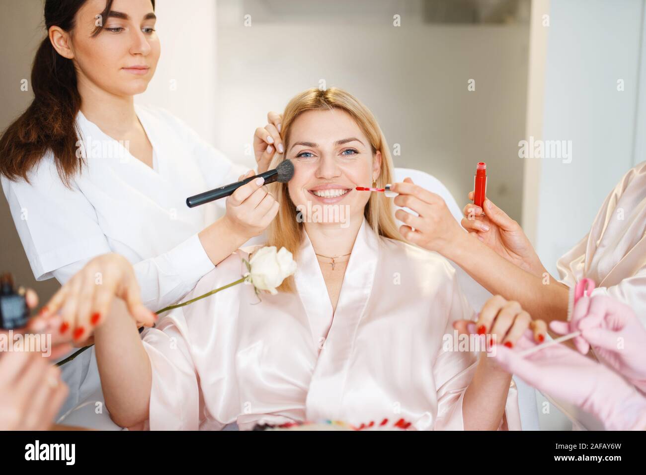 Four beauticians and one female customer Stock Photo Alamy