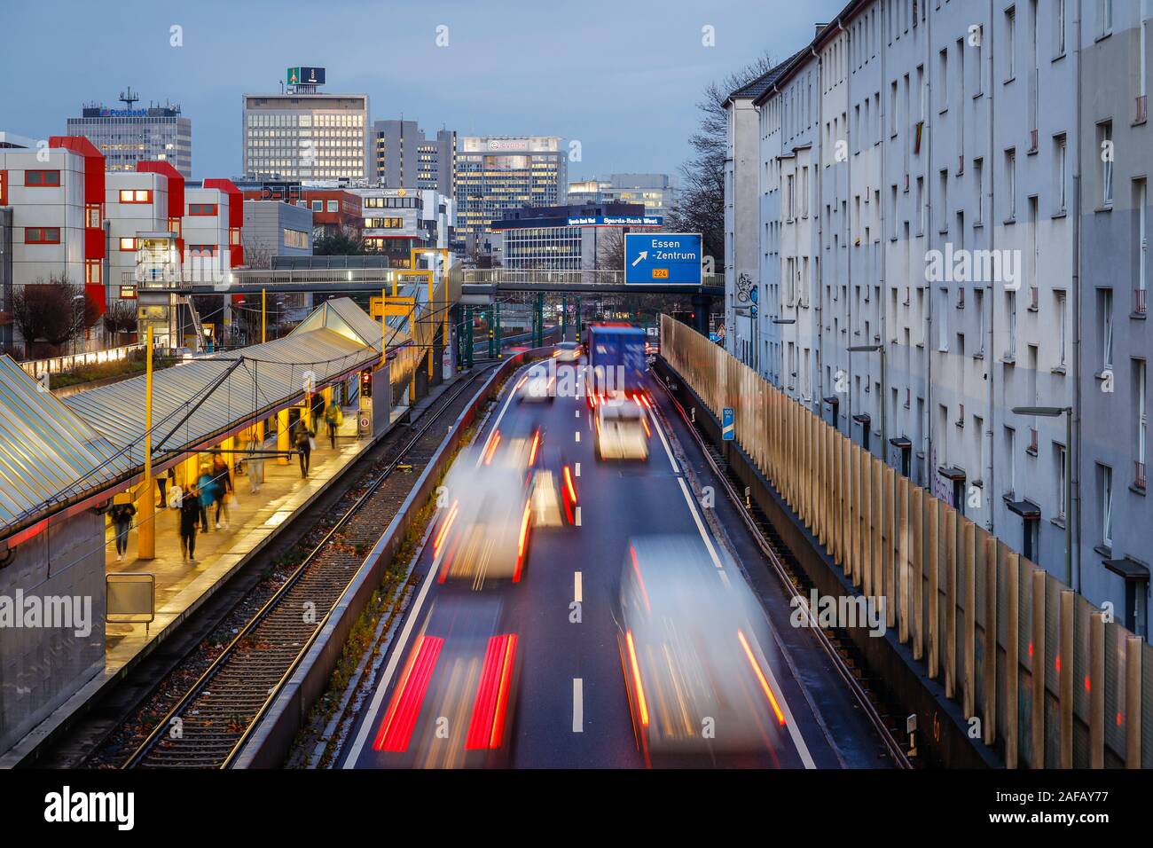 Essen, Ruhr area, North Rhine-Westphalia, Germany - Trucks and cars drive on the A40 motorway to the city centre of Essen in the evening traffic. Esse Stock Photo