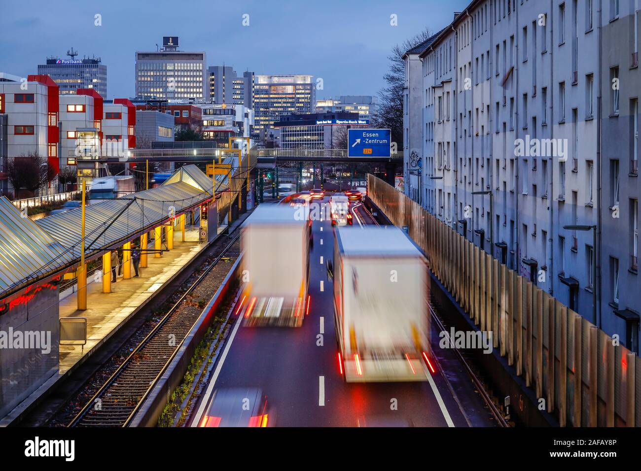 Essen, Ruhr area, North Rhine-Westphalia, Germany - Trucks and cars drive on the A40 motorway to the city centre of Essen in the evening traffic. Esse Stock Photo