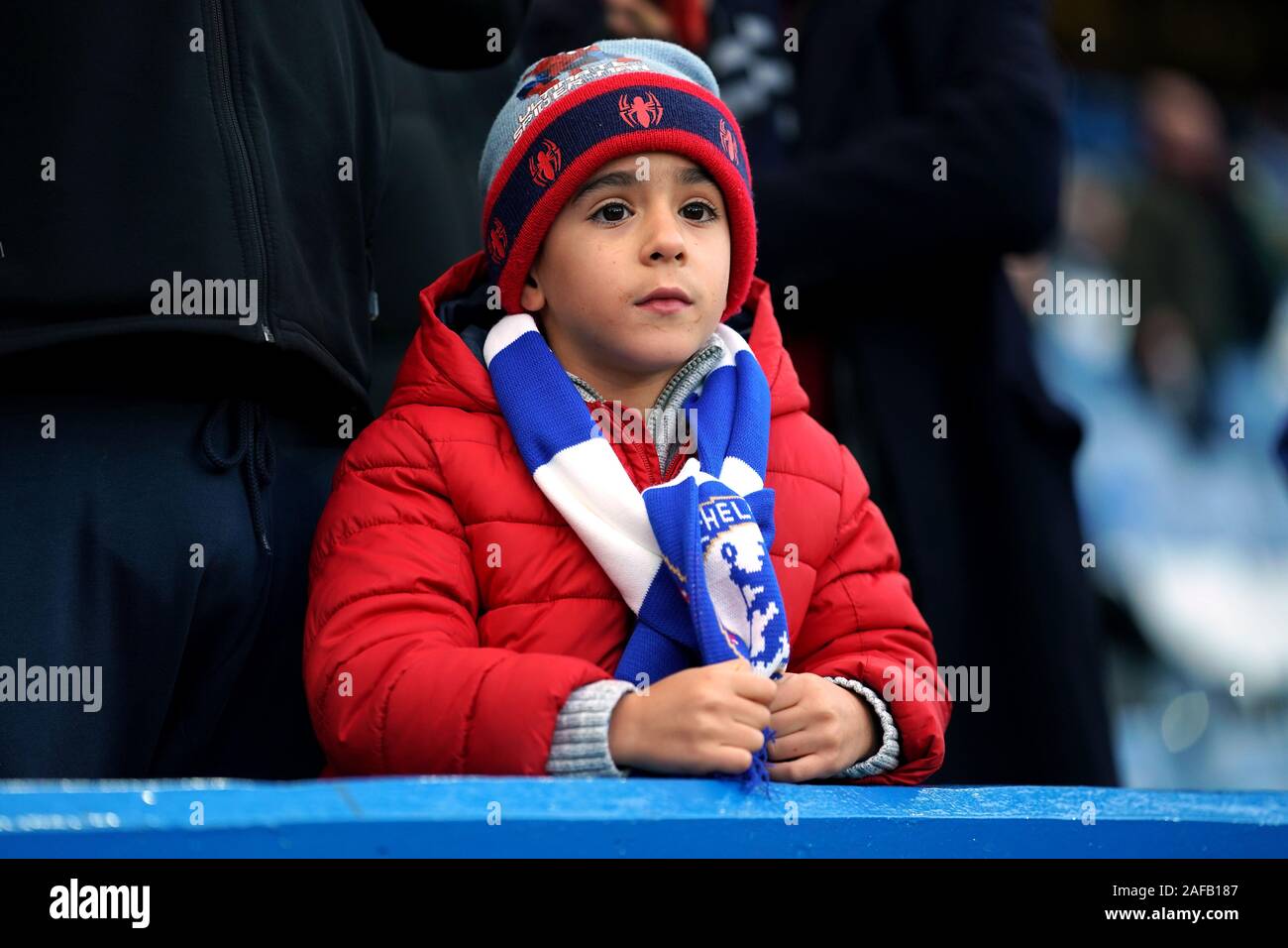 A young Chelsea fan in the stands during the Premier League match at Stamford Bridge, London. Stock Photo