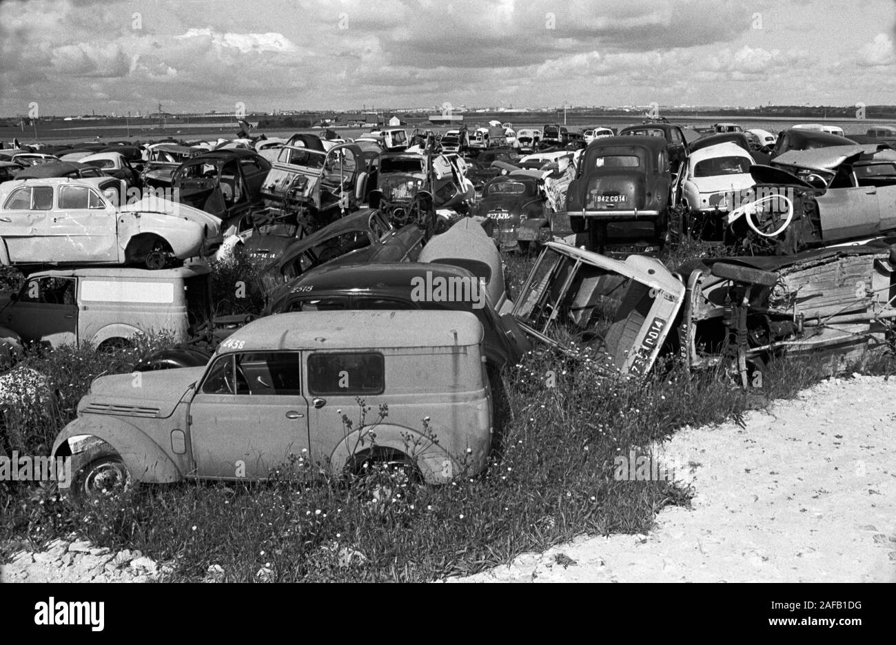 French landscape cars dumped in fields . Scrap metal 1960s Normandy