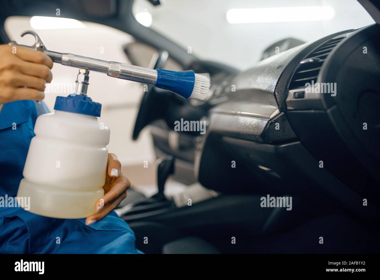 Female washer with steam cleaner, car wash Stock Photo Alamy