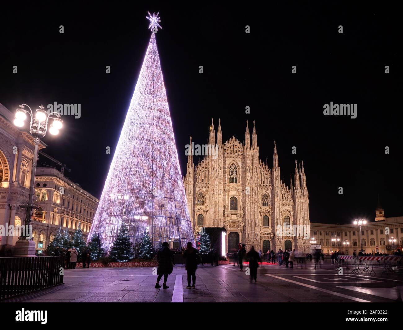 Milan, Italy - December 10 2019: Artificial Christmas tree in front of Milan cathedral, Duomo square in december, night view. Stock Photo
