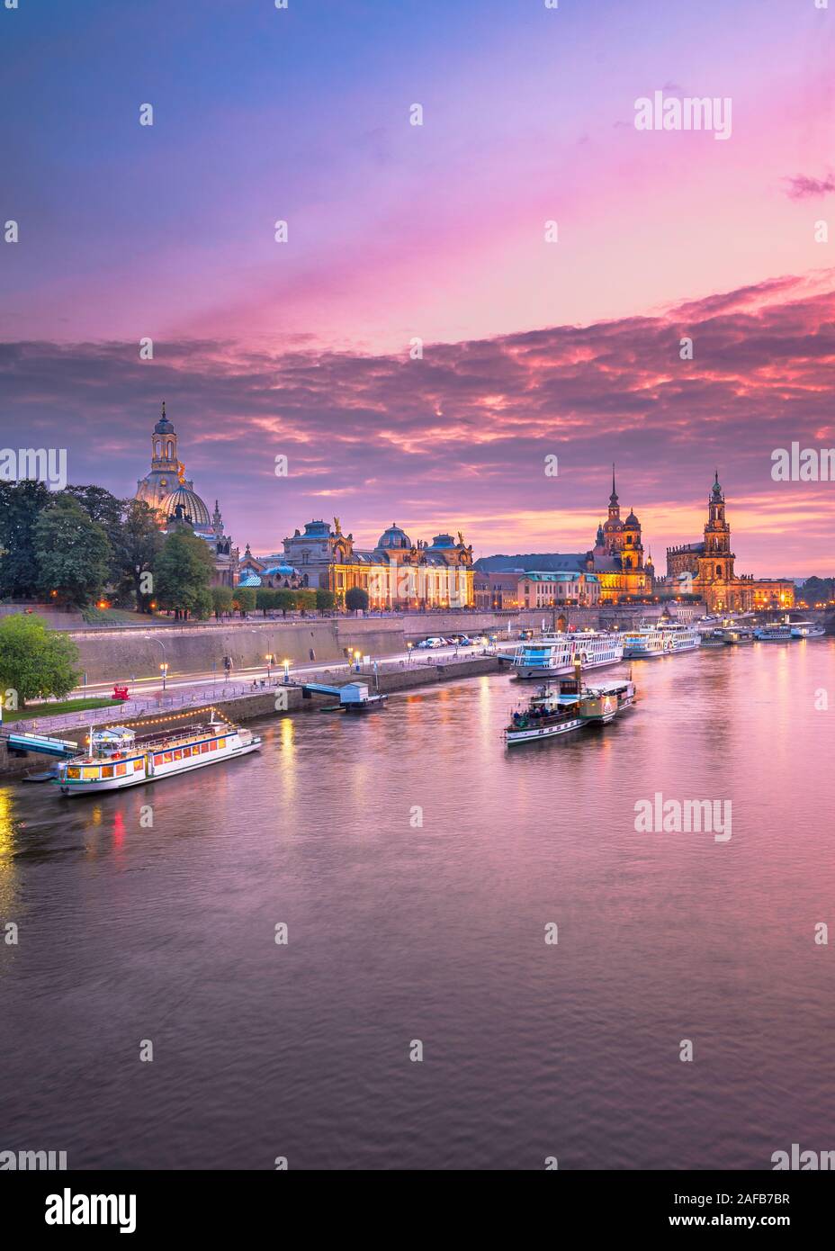 Dresden, Germany cityscape of cathdedrals over the Elbe River at dusk. Stock Photo