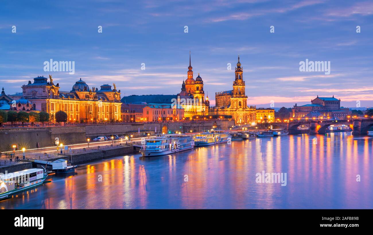 Dresden, Germany cityscape of cathdedrals over the Elbe River at dusk. Stock Photo