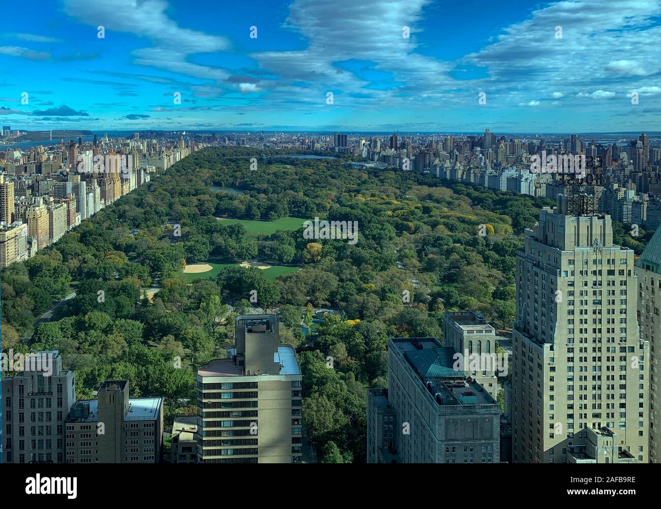 Aerial view along Central Park in New York City from Midtown Manhattan ...