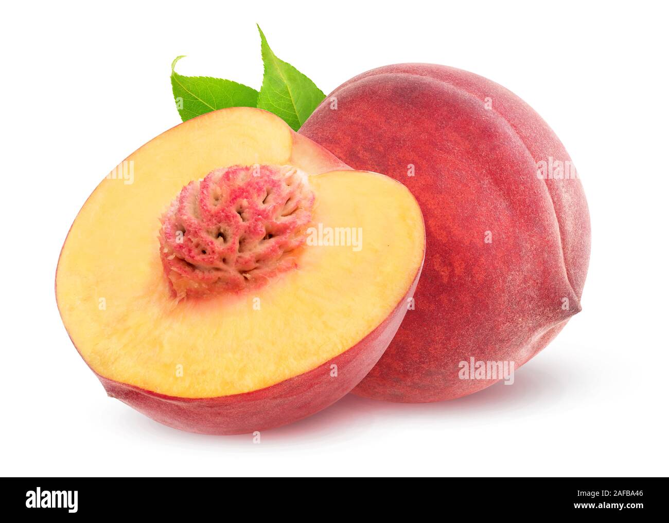 Isolated peaches. One whole peach fruit and a half with kernel isolated