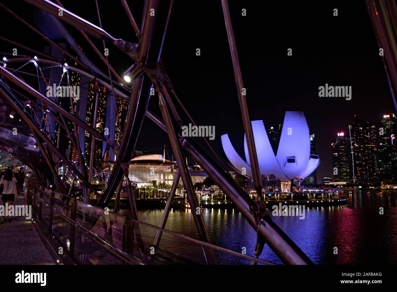 Panorama of Marina Bay at night, from bridge viewpoint to lotos flower shape building Stock Photo