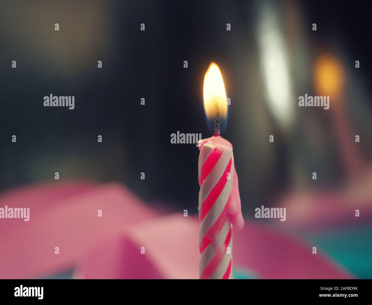 Burning Birthday Candle Cake On A color Background Stock Photo Alamy