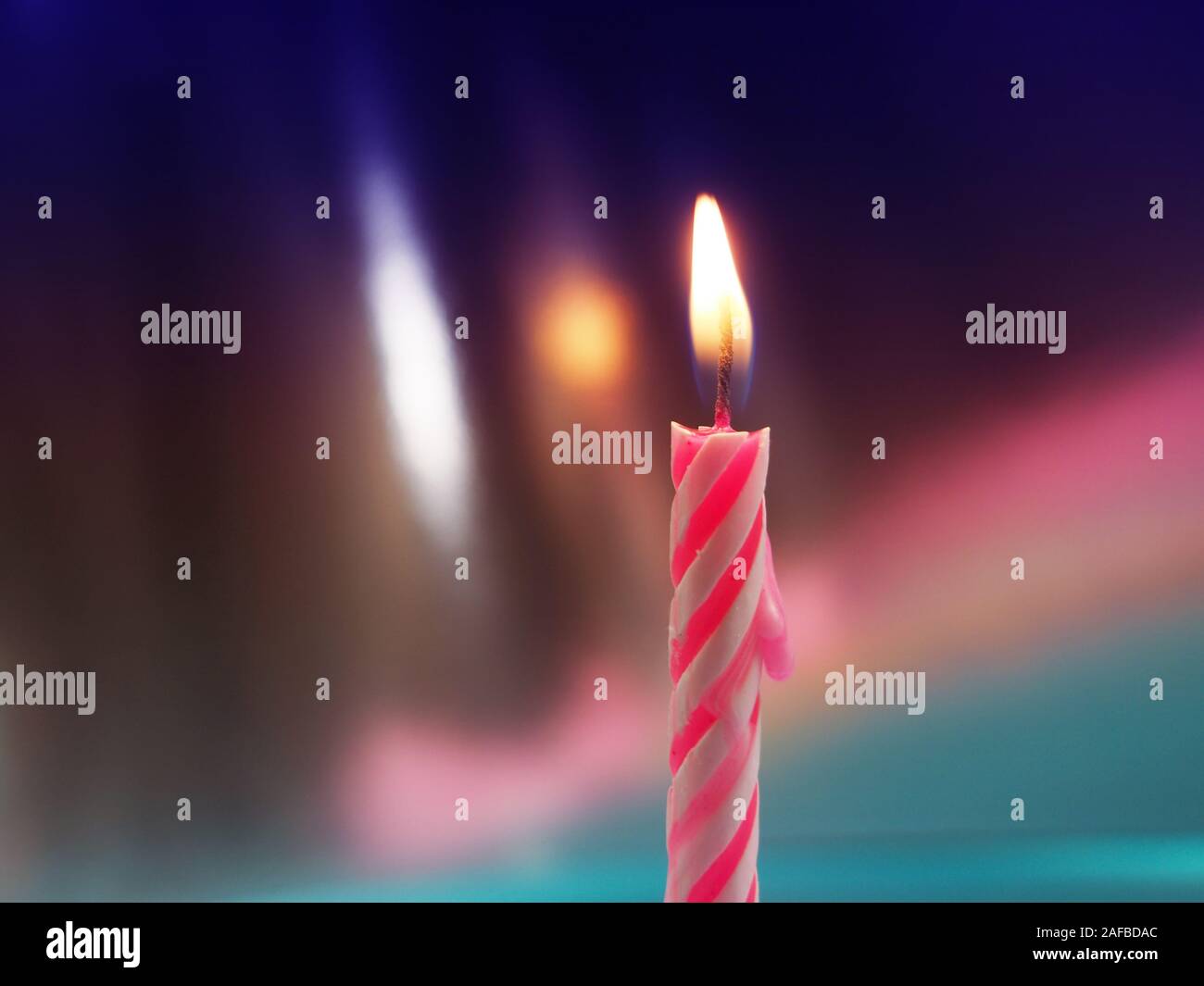 Burning Birthday Candle Cake On A color Background Stock Photo Alamy
