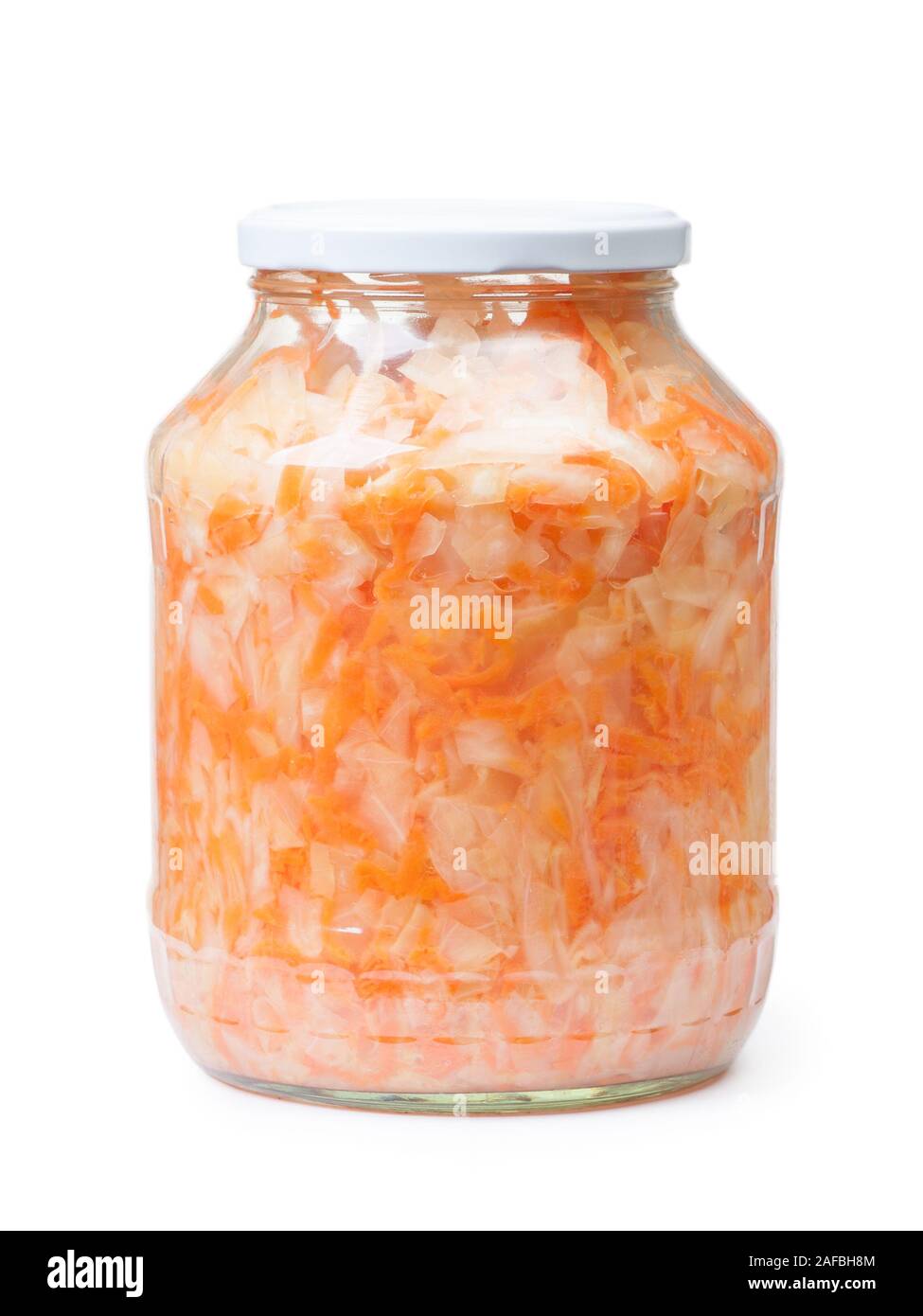 Sour cabbage fermented sauerkraut with carrot in a jar. Marinated canned cabbage isolated on