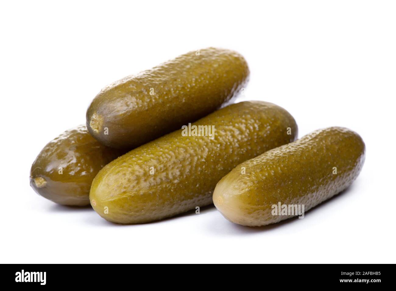 Marinated pickled cucumbers isolated on white background Stock Photo
