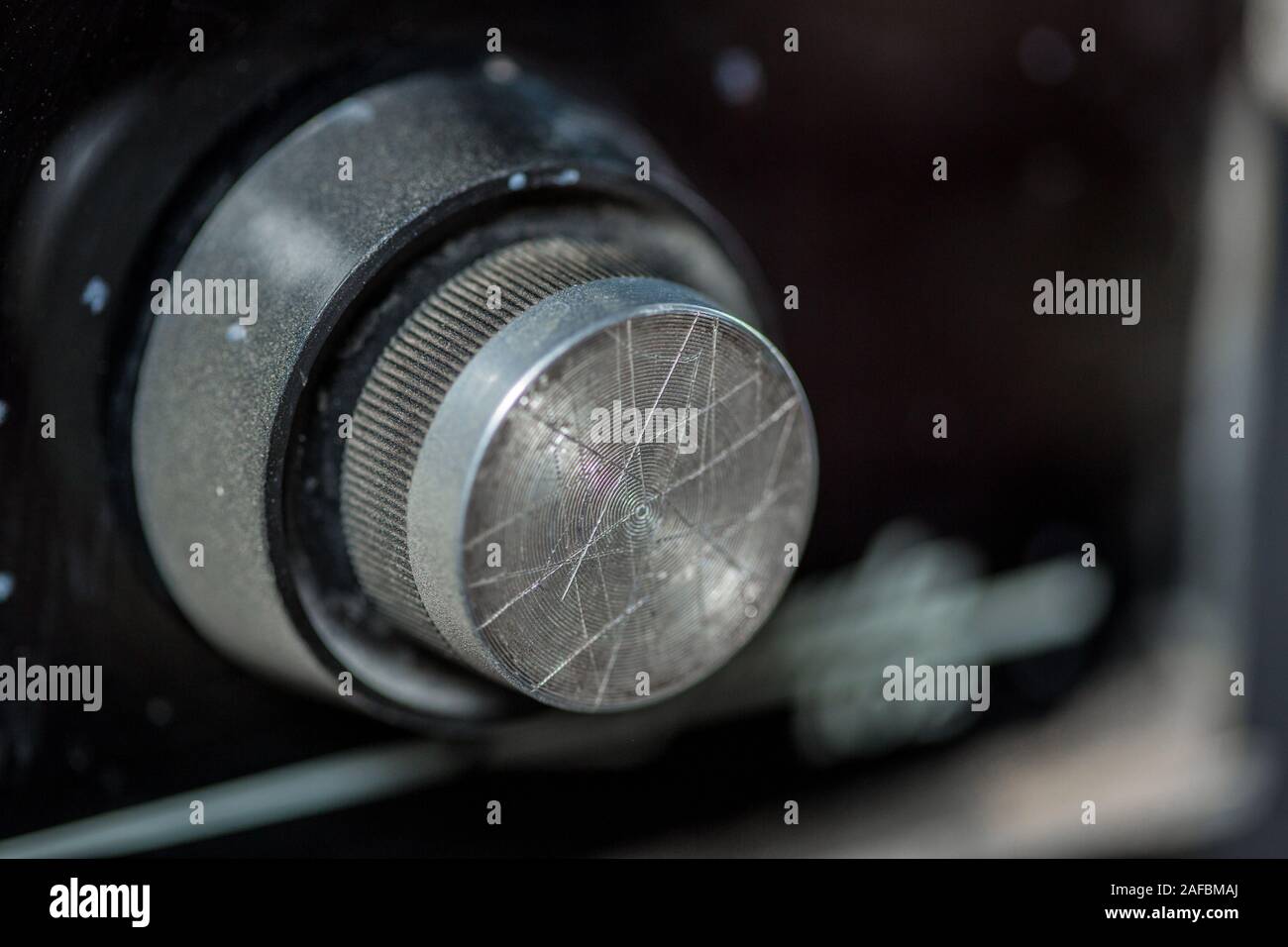 vintage radio tuning knob closeup . blurred background. small focusing