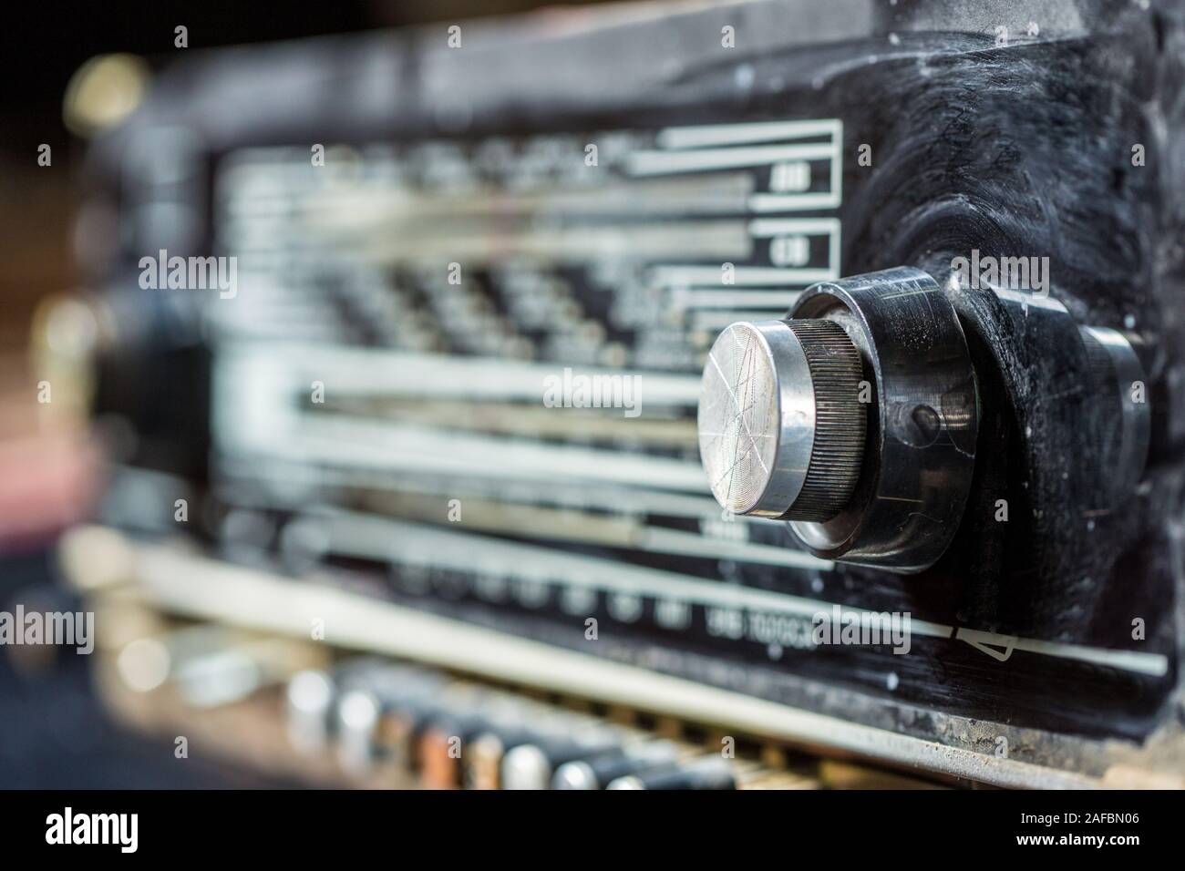 vintage radio tuning knob closeup . blurred background. small focusing area, selective focus
