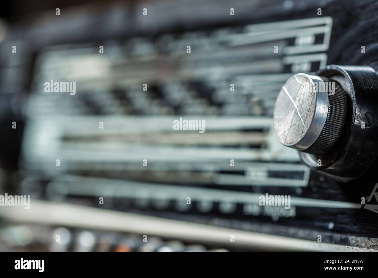 vintage radio tuning knob close-up . blurred background. small focusing ...