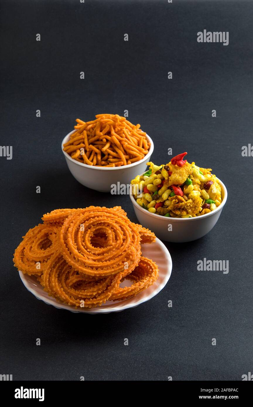 Indian Snack : Chakli, chakali or Murukku and Besan (Gram flour) Sev and chivada or chiwada. Diwali Food Stock Photo