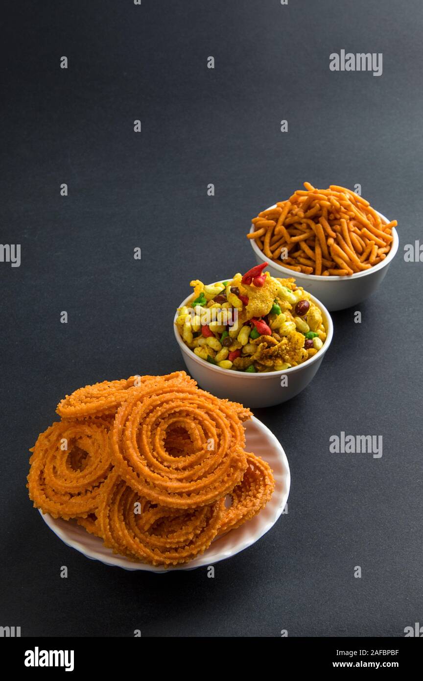 Indian Snack : Chakli, chakali or Murukku and Besan (Gram flour) Sev and chivada or chiwada. Diwali Food Stock Photo
